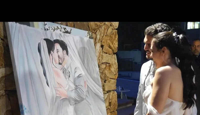 Los novios descubren el cuadro de Live Art pintado durante su boda